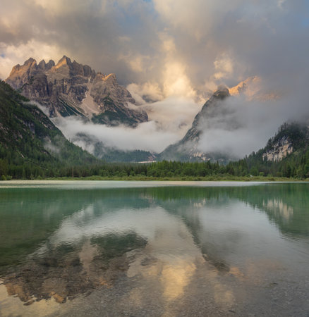Amazing Mountains Lake at the misty morning. Nature Landscape. Lago di Landro Durrensee, Dolomites, Alps, Italy, Europe.の写真素材