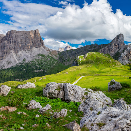 Summer Mountain green valley landscape with road, summer day in Dolomites Alps, Europeの写真素材
