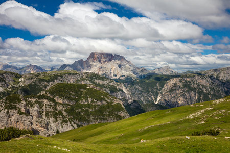 Sunny Mountain Landscape with big peaks of Dolomites whith blue sky and grass valley, Passo di Giau,  Alps, Italy, Europe.の写真素材