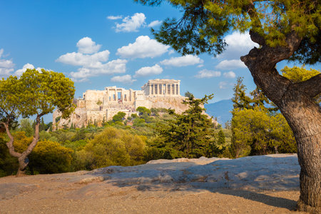 Amazing view of  Acropolis hill, Athens, Greece. Famous old Acropolis is a top landmark of Athens. Ancient Greek ruins in the Athens center in summer. Scenic view of remains of antique Athens cityの写真素材