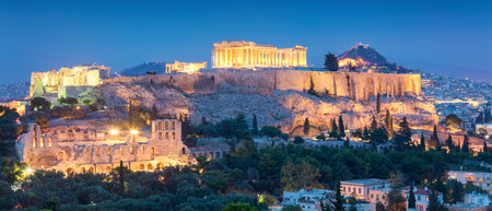 Panoramic view of the Acropolis Hil  with Parthenon, above of the city skyline during evening blue hour in Athens, Greeceの写真素材