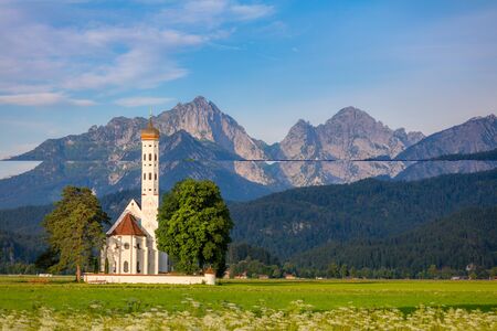 Beautiful Landscape with Historical chirch St. Coloman and Mountains, Germany, europeの写真素材