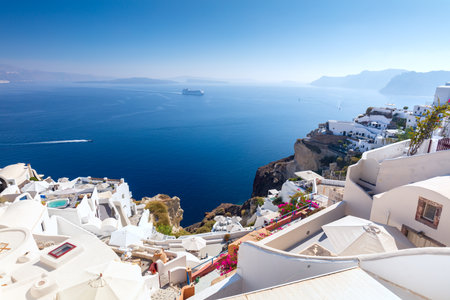 Oia town cityscape at Santorini island in Greece. Traditional white houses. Greece, Aegean sea. Famous European destinationの写真素材