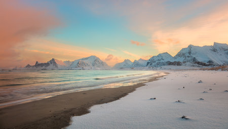 Winter sunset over the sea coast and mountains, colorful northern sunrise and sunlight in pink clouds. Lofoten Islands, Norway, Europeの写真素材