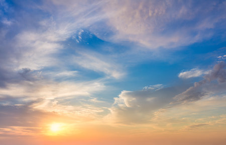 Real sundown sunset sky with beautiful light clouds and sun, wothout any birds. Huge resolutionsの写真素材