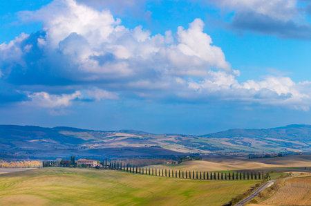 Sunny Tuscany landscape - beautiful hills and sky with clouds, amazing weather and nature, Tuscany, Italy, Europe. Panoramaの写真素材