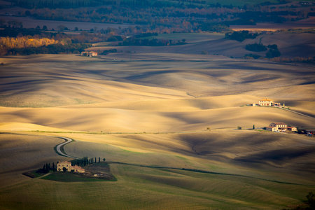 Beautiful Aerial landscape of waves hills valley in rural nature, Tuscany farmland, Italy, Europeの写真素材