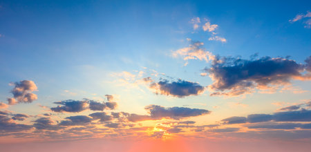 Majestic dramatic sky - sunshine on sunrise sundown sky background with colorful clouds. Panoramicの写真素材