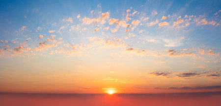 Majestic panoramic view of the sunrise in the morning sky. Light gentle clouds. Sundown Natural sky...