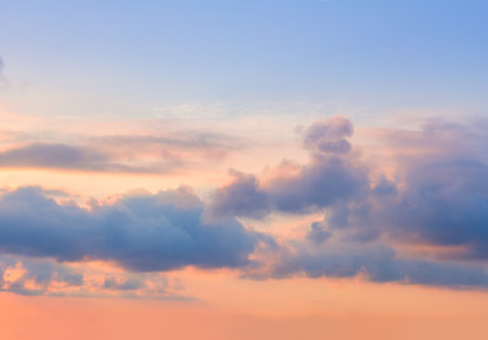 Majestic pastel sunrise sundown sky background with colorful clouds. Sunset sky clouds backgroundの写真素材