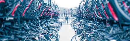 Bicycles Background - Large public city bike parking. Eco-friendly transport for a healthy life. Bicycle parking in Amsterdam, Holland, Europe. Panoramic viewの写真素材