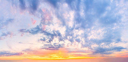 Sky - Background of Light cirrus clouds in the blue sky during dawn sunsetの写真素材
