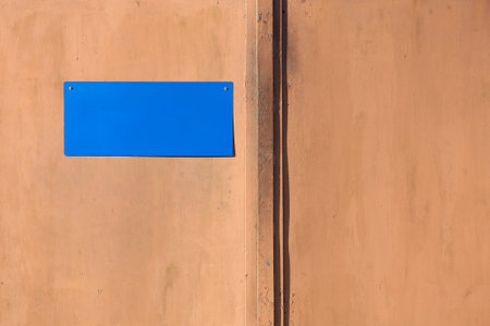 Metal gates with a blue plate on itの写真素材