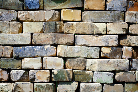 Background of stacked old bricksの写真素材