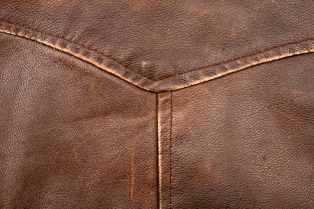 Scratched worn leather texture with seam  の写真素材