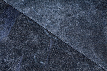 Scratched worn suede texture with seam  の写真素材