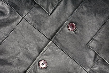 Fragment of black leather jacket  