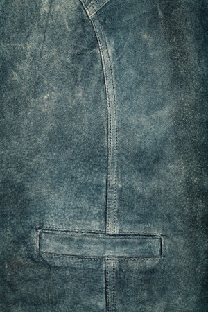 Old worn suede vest fragment with side pocket の写真素材