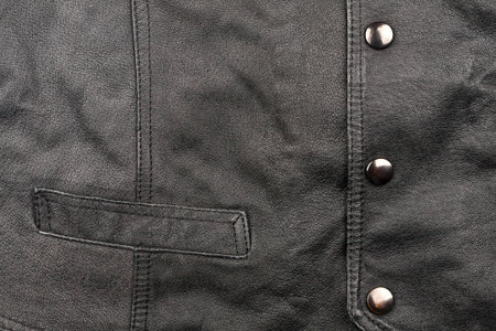 Fragment of black leather vestの写真素材