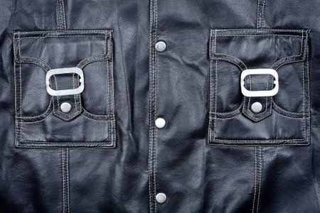 Fragment of black leather jacket  wit some pocketsの写真素材