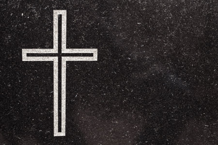 Cross carved in black graniteの写真素材