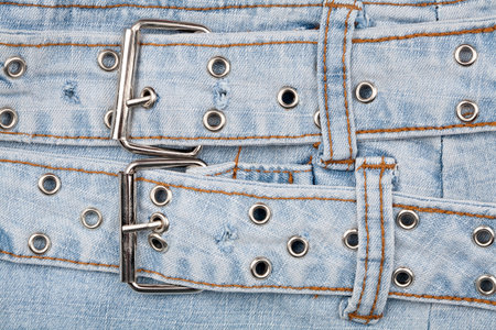 Closeup shot of jeans front with massive belt 