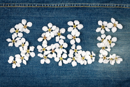 Word sale made of flowers on jeans textureの写真素材