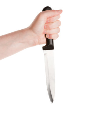 Knife in hand isolated on a white background の写真素材