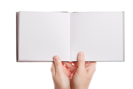Opened book in hands isolated on white backgroundの写真素材