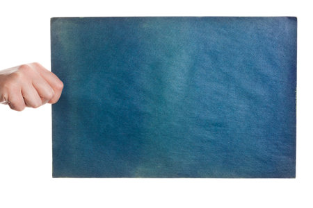 Blue rough paper in woman hand isolated on white background  