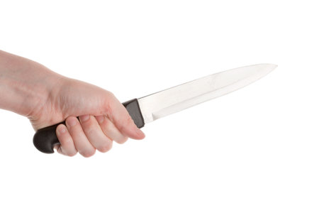 Knife in hand isolated on a white background の写真素材