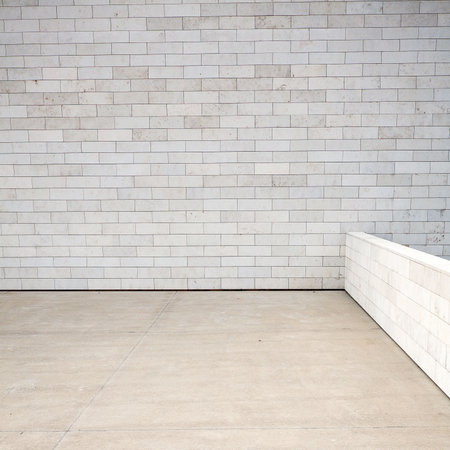 Tiled wall with a blank white bricks  の写真素材