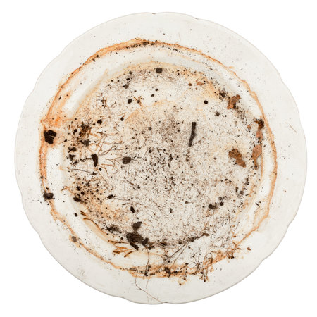 Dirty plate isolated on white backgroundの写真素材