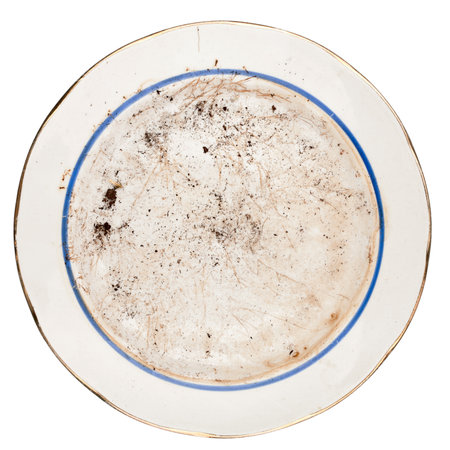 Dirty plate isolated on white backgroundの写真素材