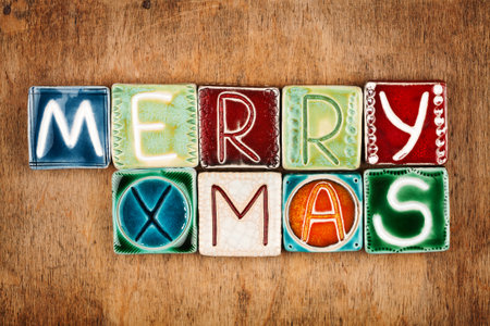 Words "merry xmas" made from ceramic letters on wood textureの写真素材