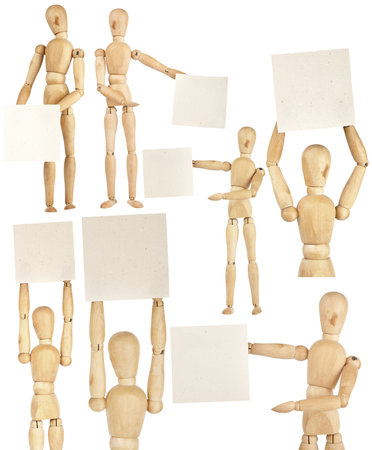 Set of wooden dummies holding handmade paper isolated on a white backgroundの写真素材