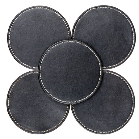 Round black leather table coasters isolated on whiteの写真素材
