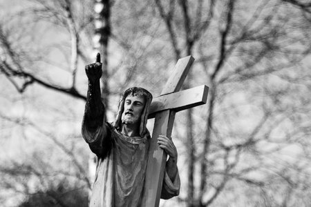 Statue of Jesus Christ at Rasu cemetery in Vilnius, Lithuania, monochrome image