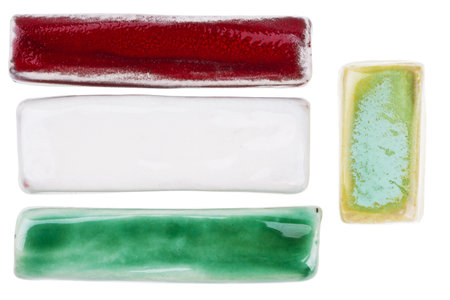 Handmade glazed ceramic elements isolated on whiteの写真素材