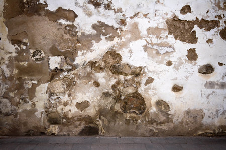 Aged weathered street wall background の写真素材