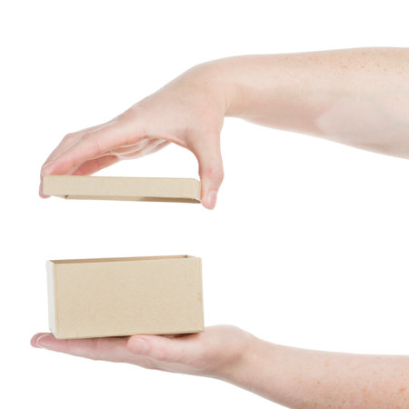 Female hands opening cardboard box isolated on white background