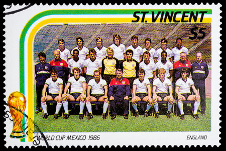 ST. VINCENT - CIRCA 1986: A stamp printed in St. Vincent shows soccer team of England, circa 1986 のeditorial素材