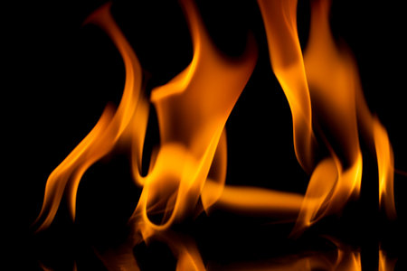 Fire flames isolated on black background の写真素材