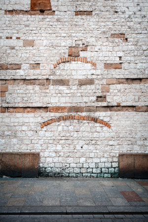 Ancient stone wall and a sidewalkの写真素材