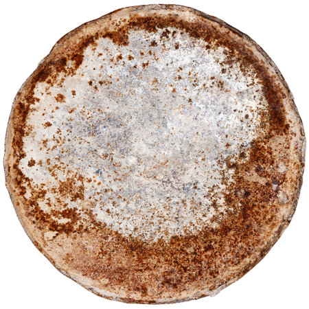 Rusty round metal plate isolated on whiteの写真素材