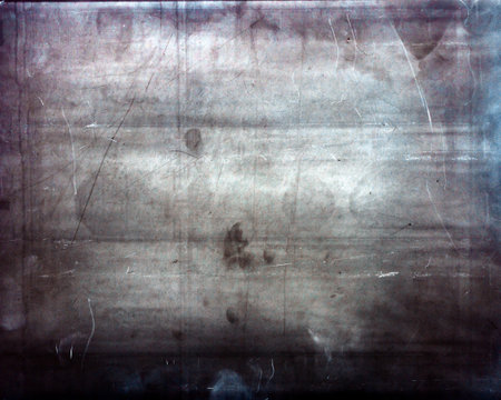 Designed medium format film background with heavy grain, dust and light leakの写真素材