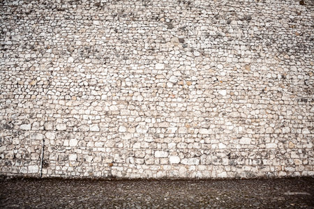 Wall of stones and a stone pavingの写真素材