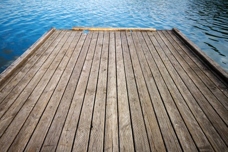Old wooden bridge and lakeの写真素材