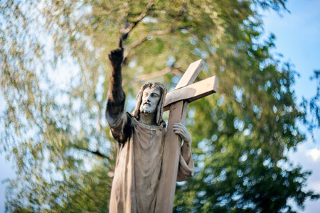 Statue of Jesus Christ at Rasu cemetery in Vilnius, Lithuania. Shot taken with a soft focus lens,...