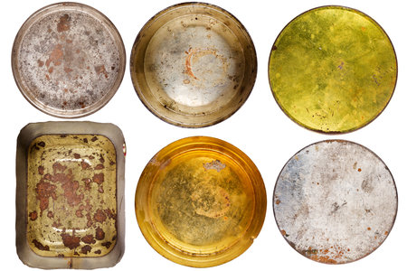 Set of rusty round metal cans isolated on whiteの写真素材